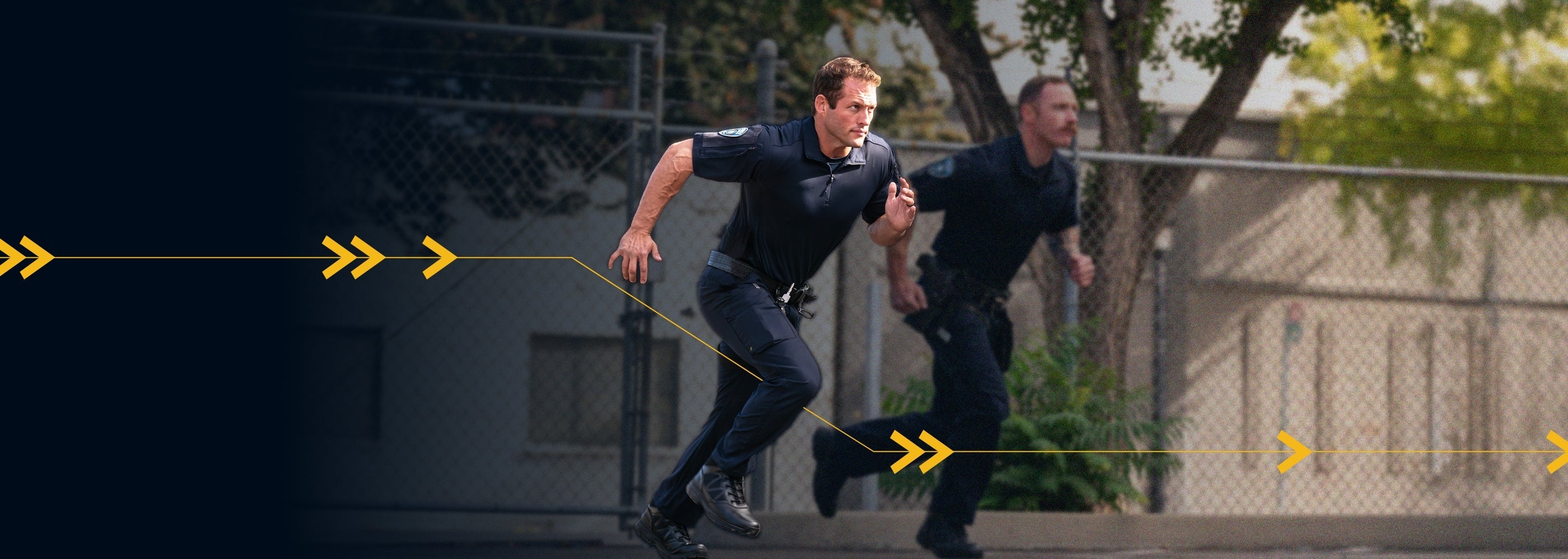 Two male officers wearing the midnight navy V2 tactical pants.